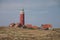 Red lighthouse, little houses on Texel