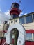 Red Lighthouse mounted atop a ship