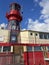 Red Lighthouse mounted atop a ship