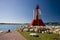 Red lighthouse among the rocks