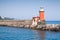 Red lighthouse tower, entrance of Ischia Porto