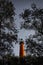 Red Lighthouse under steely blue sky