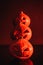 red lighting on creepy pumpkins in