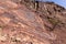Red limestone and dolomite rock formations in Hajar Mountains on Arabian Peninsula, United Arab Emirates, Hatta