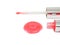 Red lip gloss sample with applicator