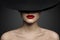 Red Lips Make up Closeup. Mysterious Fashion Woman Face Hidden by Black brimmed Hat. Elegant Retro Lady Fine Art Portrait