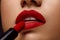 Red Lipstick. Closeup Of Woman Face With Bright Lips Makeup