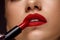 Red Lipstick. Closeup Of Woman Face With Bright Lips Makeup