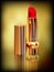 Red lipstick in gold tube. Created with gradient meshes.