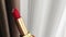 Red lipstick in golden tube as luxury cosmetic product, make-up and beauty