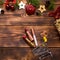 Red lipstick and lip gloss and eyelids on a wooden background in metal supermarket cart in the Christmas decor. Holiday makeup for