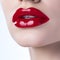 Red lipstick lips. Beautiful woman lips with fashion red lipstick makeup. Cosmetic, fashion make-up concept. Beauty Lip Visage.