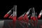 Red lipsticks marching in a row on a black background. 3d illustration. 3d illustration