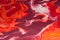 Red Liquid marble pattern, vibrant colors, creative ink