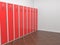 Red lockers in in the empty room. 3d illustration