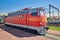 Red Locomotiv on railroad tracks. Russia, close-up wide angle