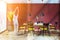 Red loft dining room interior, woman