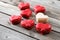 Red macaroons desserts on wooden background. dessert for breakfast on Valentine`s Day