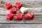 Red macaroons desserts on wooden background. dessert for breakfast on Valentine`s Day