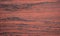 Red mahogany with black veins, close-up of a flat surface of natural wood