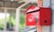 Red mail box or post box set up on the wooden wall for sending and receiving the mails and parcels. work from home and quarantine