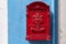 Red mail box.  Red decorative mailbox in the village of Burano in Venetian Lagoon. Colourful post box in Burano, Italy