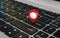 Red map pointer on laptop keyboard, gps pin, 3d rendering