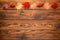 Red maple leaves and red berries form a festive garland at the top of a wooden plank board