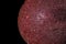 Red marble ball, black background