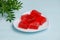 Red marmalade on a white porcelain plate in the shape of a heart. Photos of desserts for proper nutrition. Valentine`s Day food