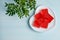 Red marmalade on a white porcelain plate in the shape of a heart. Photos of desserts for proper nutrition. Valentine`s Day food