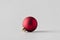 Red matte Christmas ball on a seamless grey background