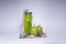 Red measuring tape over green sport bottle, apple and kiwi. Diet and Healthy life, sport concept. Copy space. Isolated