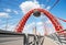 Red metal arch over the highway