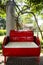 Red metal bench decoration and furniture in public garden park made from gas oil iron tank