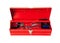 Red metal tool box with tools on white