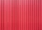 Red metal vertical fence as background