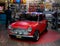 Red mini cooper car as British simbol with union Jack flag on the roof, London February 23 2020