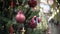 Red mirror and matte balls and golden star. New Year`s and abstract blurred shopping mall background with Christmas tree