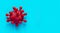 Red model of coronavirus on blue paper background with copy space