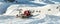 Red modern snowcat ratrack with snowplow snow grooming machine preparing ski slope piste hillalpine skiing winter resort