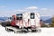 Red modern snowcat ratrack with snowplow,snow grooming machine,remover truck preparing ski slope,piste,hill at alpine