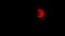 Red Moon Revealed From Behind Black Clouds