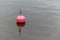 Red mooring buoy