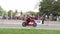 Red motorcycle drifting racing during annual Ottawa Ferrari festival. Little