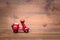 Red motorcycle vespa on old and vintage rustic wooden background