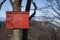 Red mountain guidepost along an alpine pathway