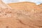 Red mountains containing a lot of copper surround the deep blue Hidden Lake near the Timna park,surrounded by mountains near