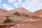 Red mountains containing a lot of copper surround the deep blue Hidden Lake near the Timna park,surrounded by mountains near