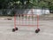 Red Movable Fence with Wheels on the Road